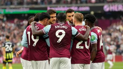 West Ham players celebrate after Ruben Dias's own goal that made it 1-1 against the run of play. AP