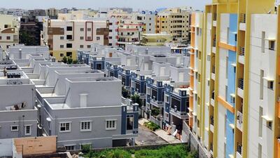Reits mainly invest in income-producing real estate assets and their earnings are mostly distributed to their shareholders. Above, newly constructed residential apartments on the outskirts of Hyderabad. Noah Seelam / AFP