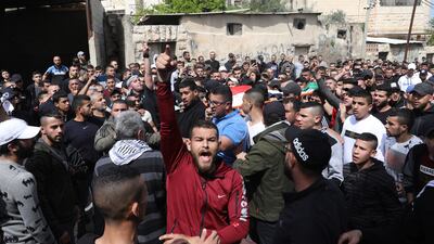 Palestinians carry the body of Mohamed Zakarneh during his funeral in the West Bank city of Jenin, on April 11. EPA