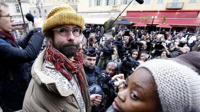 French farmer Cedric Herrou leaves the court in Nice, France, on February 10, 2017, with Khadidja, a young Malian migrant, after his trial for illegally assisting migrants. Mr Herrou, convicted of helping migrants enter, travel and stay in France, said it is an act of humanity and not a crime, and says it is his civic duty to keep helping the migrants. EPA/SEBASTIEN NOGIER