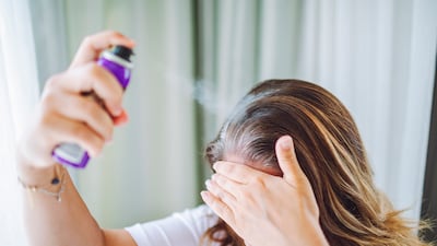 From hair colour sprays to tinted powders, there are various ways to cover grey hair. Getty Images