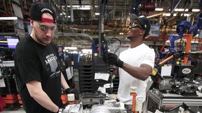 Workers prepare parts for the 2014 Jeep Cherokee at the Chrysler Toledo North Assembly Plant. Bill Pugliano / Getty Images / AFP