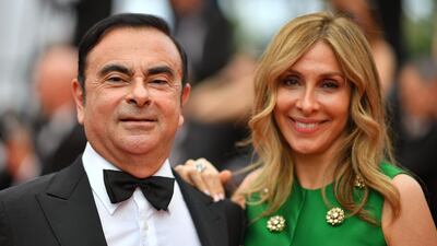 This file photo taken on May 26, 2017 shows Renault CEO Carlos Ghosn (L) and his wife Carole Ghosn at the 70th edition of the Cannes Film Festival in Cannes. In a letter to Human Rights Watch, Mrs Ghosn alleged her husband is being held in "harsh" conditions and subjected to round-the-clock interrogations intended to extract a confession. AFO