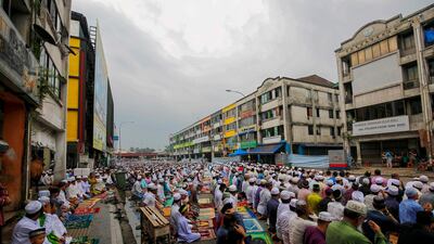 Rohingya Muslims pray on a street during Eid Al Adha celebrations in Kuala Lumpur, Malaysia. EPA