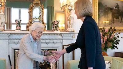 Queen Elizabeth II greets the newly elected leader of the Conservative Party, Ms Truss, at Balmoral Castle in Scotland in September. The queen invited Ms Truss to become prime minister and form a new government. Getty Images