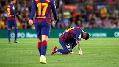 Barcelona's Lionel Messi struggles with the effects of an injury. Reuters