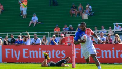 New Zealand, in black, faced off against France on Day 2 at the Dubai Rugby Sevens. Victor Besa for The National