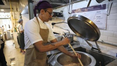 Chef Rodrigo Ottoni stirs food, credit Peter Yeung.jpg