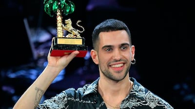 Italian singer Mahmood celebrates on stage after winning the 69th Sanremo Italian Song Festival at the Ariston theater in Sanremo, Italy. AP