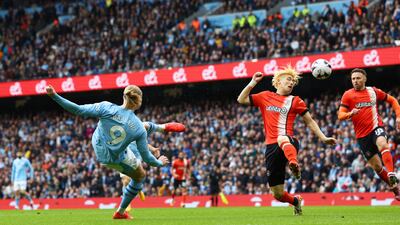 Erling Haaland's shot is deflected off Luton Town's Daiki Hashioka for an own goal. Action Images