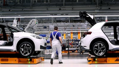 A Volkswagen factory employee works on an electric car assembly line in Germany, which plans to overhaul its flagship industry. AFP