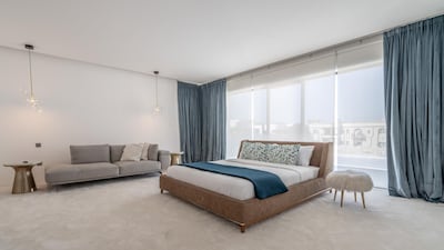 The villa has five bedrooms, all with walk-in closets.