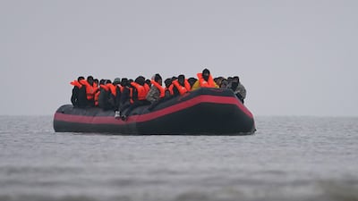 Migrants on board a small boat cross the English Channel from Gravelines, France, in an attempt to reach the UK. PA Wire