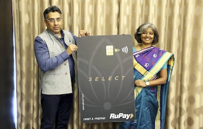 Arif Khan, NPCI chief digital officer, and Praveena Rai, NPCI chief operating officer, showing the RuPay international card during a press conference held in Dubai Thursday. Pawan Singh / The National