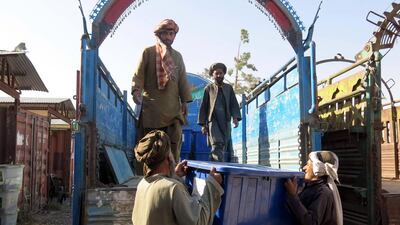 Afghan workers load electoral materials on a truck to be sent to polling station in Kandahar, Afghanistan. Afghans head to the polls on June 14, 2014 to choose a new president in a run-off election that will see Abdullah Abdullah and Ashraf Ghani compete with each other. Muhammad Sadiq/ EPA