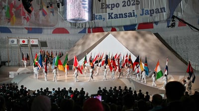 Performers parade participating countries' flags during the official opening ceremony of the 2025 Osaka Expo. AFP