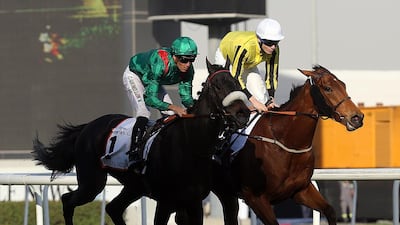 Jockey Christophe Soumillon, left, rides Vazirabad to a win at the Dubai Gold Cup sponsored by Al Tayer Motors during the Dubai World Cup at the Meydan Racecourse in Dubai. Satish Kumar / The National