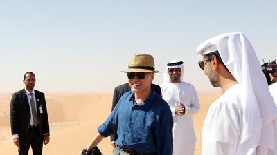 South Korean President Moon Jae-in goes barefoot as he walks on desert sand at a resort near Abu Dhabi. The brief trip 170 km from Abu Dhabi was arranged impromptu by the Crown Prince of Abu Dhabi, Sheikh Mohammed bin Zayed, who was told of Moon's wish to experience the desert and provided helicopters and vehicles. EPA /Yonhap news agency