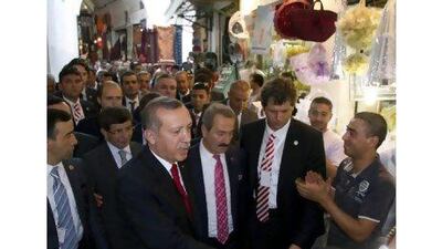 Turkish prime minister Recep Tayyip Erdogan tours the souk market in Tunis yesterday as part of a two-day visit to Tunisia. Hamine Landoulsi / AP Photo