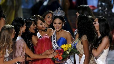 Pia Alonzo Wurtzbach surrounded by contestants after being crowned. Reuters
