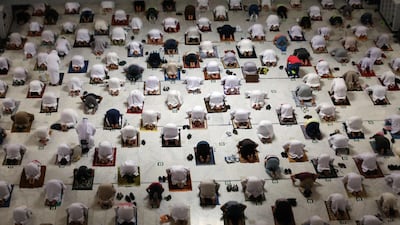 The faithful face the Kaaba during taraweeh prayers on the first day of the holy fasting month. Since the start of Ramadan only worshippers immunised against Covid-19 are allowed to perform Umrah. AFP