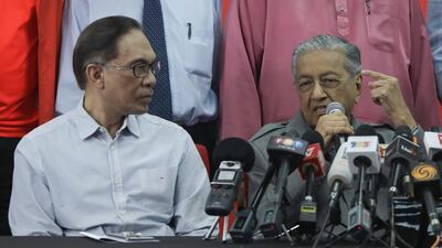 Mahathir Mohamad, right, speaks as Anwar Ibrahim looks on during a news conference in Kuala Lumpur in 2018. EPA