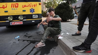 An injured person in the aftermath of Friday's Israeli strikes on Tehran. Where this cycle of violence and destruction will end is increasingly unclear. Reuters