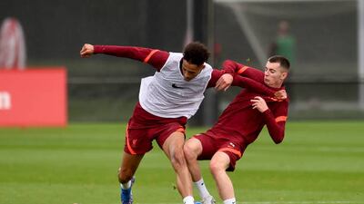 Ben Woodburn and Rhys Williams during Liverpool's training session.