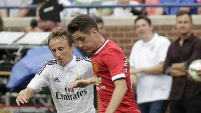 Manchester United got in Ander Herrera early, right, as a show of intent to make up for last season's folly. Getty Images