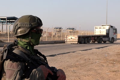 An Israeli soldier stands near a lorry at the Karem Abu Salem crossing between southern Israel and the Gaza. AFP
