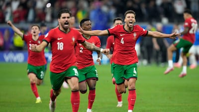 Portugal's players celebrate after winning on penalties. AP