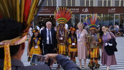 Members of the indigenous Pareci people of central Brazil with other participants at Cop28 in Dubai. Getty Images