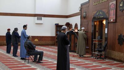 Imam Magdy Badr leads prayers over a live broadcast on a laptop in a nearly empty room at Masjid Al Salaam mosque on the first full day of Ramada on April 24, 2020 in Dearborn, Michigan. Getty Images via AFP