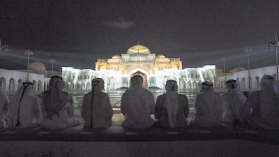 Sheikh Mohammed bin Rashid and Sheikh Mohamed bin Zayed and HH Sheikh Tahnoon bin Mohamed, Ruler's Representative in Al Ain Region, watch a light show projected onto Qasr Al Watan during the opening of the palace.