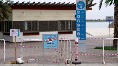 No entry signs at Corniche Beach in Abu Dhabi in April. Public beaches and parks were closed in March to prevent the spread of Covid-19. Victor Besa / The National