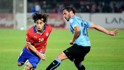 Jorge Valdivia, left, in Copa America action against Uruguay. He will complete his move to Al Wahda when Chile's involvement in the tournament ends. Martin Bernetti / AFP / June 24, 2015