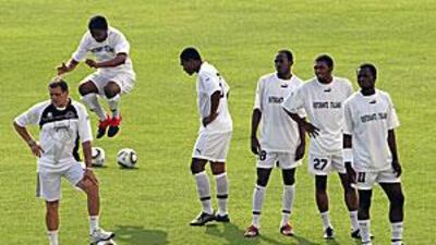 The TP Mazembe coach Diego Garzito, left, during training yesterday at Al Dhafra's ground.