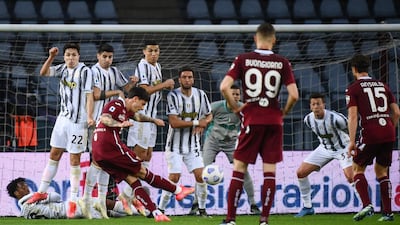 Torino's Italian midfielder Daniele Baselli shoots a free kick. AFP