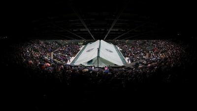 Britain Tennis - Wimbledon - All England Lawn Tennis & Croquet Club, Wimbledon, England. General view of the cover over court 1 as rain delays play. Reuters