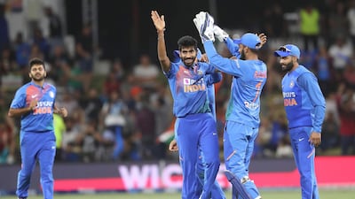 India’s Jasprit Bumrah, centre, celebrates after taking the wicket of New Zealand’s Daryl Mitchell during the fifth T20 at the Bay Oval in Mount Maunganui on Sunday. AFP
