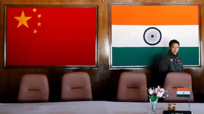 File photo showing the China and India flags side by side. India said it had reached an understanding with with Beijing to end the standoff near the Indian border that is claimed by both China and Bhutan. Adnan Abidi/Reuters