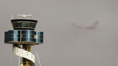 A Qantas plane takes off from Sydney airport amid thick fog in 2013. Pilots have called for better co-ordination during inclement weather conditions. Daniel Munoz / Reuters