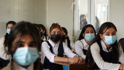Yazidi girls sit in class on the first day of school at a displaced persons camp in the Sharya area, about 15 kilometres from the city of Dohuk in Iraqi Kurdistan. AFP
