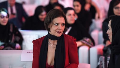 Actress Katie Holmes speaks to a Saudi woman at the Quality of Life Programme. Fayez Nureldine / AFP