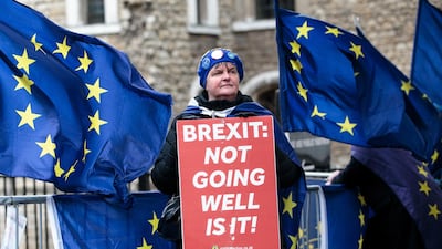 An anti-Brexit campaigner joins the noisy protests outside of parliament over Brexit. Getty