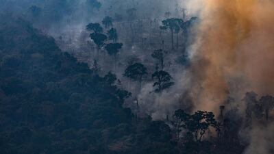In this aerial image, A fire burns in a section of the Amazon rain forest in Porto Velho, Brazil. Getty
