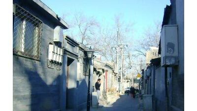 One of the old hutongs near the drum and bell towers in Beijing, surrounded by courtyard houses, that will not be redeveloped.