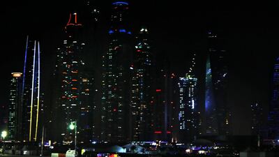 Daniel Ricciardo and Sebastian Vettel drive during an Infiniti Red Bull Racing show run in Dubai.