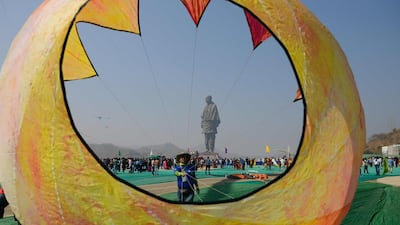 An Indian participant prepares to fly a kite during the 30th International Kite Festival near the site of the Statue Of Unity. AFP