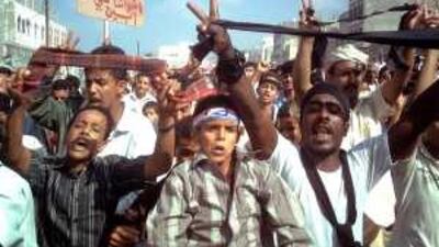 Yemenis protest yesterday in the town of al Habilain in Lahj province, 320km south of Sana'a, against an air strike that targeted a suspected al Qa'eda camp.